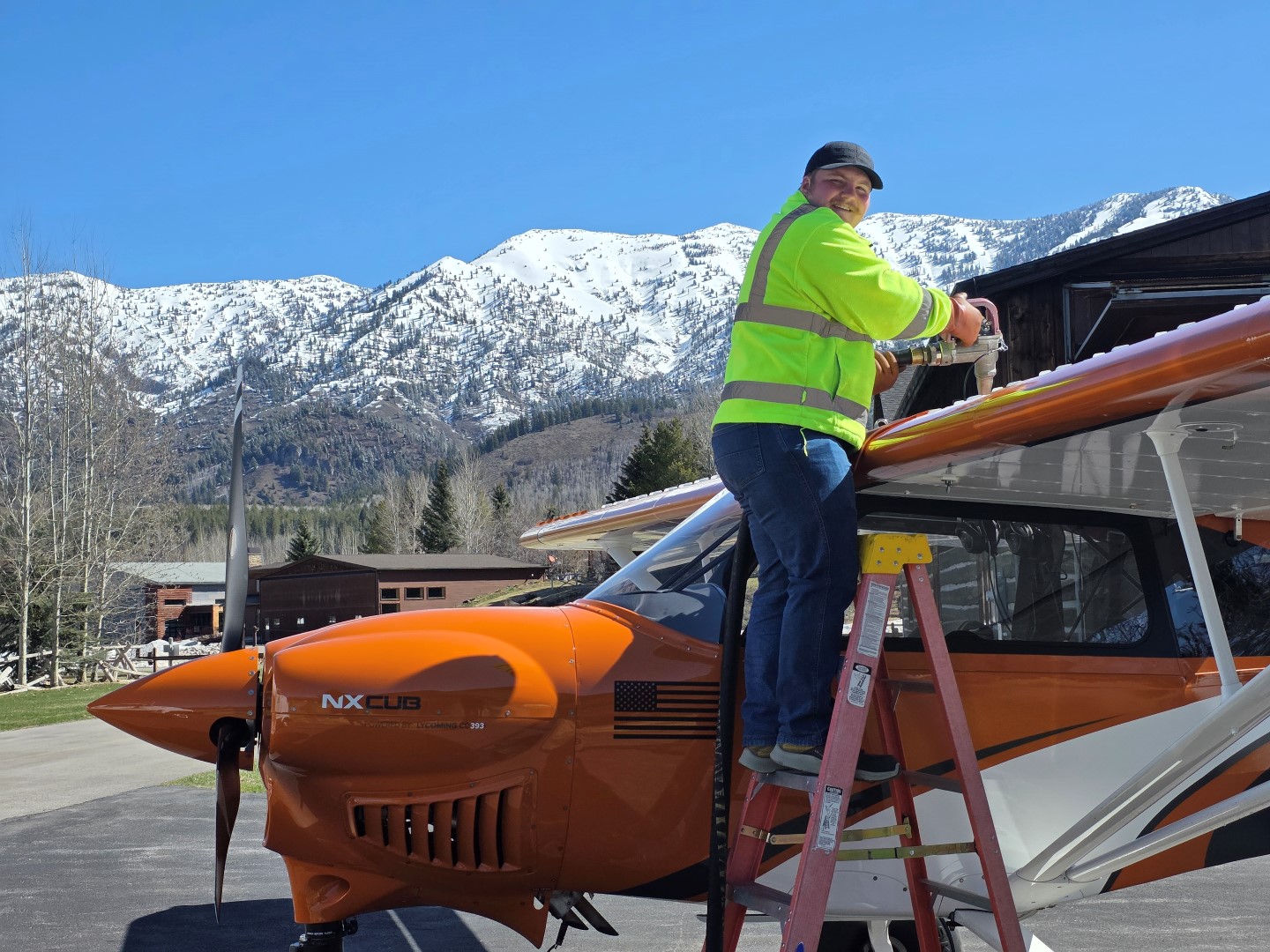 Isaac Miller fueling a private plane at Alpine Airpark 46U, a premier fly-in community near Jackson Hole, Wyoming